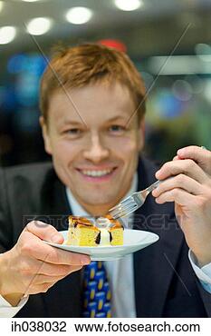 Stock Photo - businessman having 
a slice of cake. 
fotosearch - search 
stock photos, 
pictures, images, 
and photo clipart