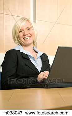 Picture - businesswoman 
working on her 
laptop. fotosearch 
- search stock 
photos, pictures, 
images, and photo 
clipart