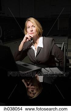 Stock Photo - businesswoman 
working late at 
night. fotosearch 
- search stock 
photos, pictures, 
images, and photo 
clipart