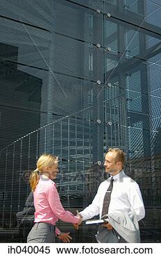 Stock Image - businessman and 
businesswoman 
shaking hands. 
fotosearch - search 
stock photos, 
pictures, images, 
and photo clipart