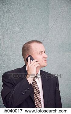 Picture - businessman talking 
on the mobile 
phone. fotosearch 
- search stock 
photos, pictures, 
images, and photo 
clipart