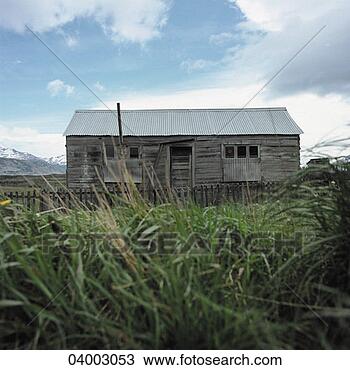 Stock Photo - an abandoned rural 
property seen 
through long grass. 
fotosearch - search 
stock photos, 
pictures, images, 
and photo clipart