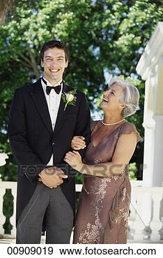 Stock Photograph - portrait of groom 
standing with 
mature female 
relative. fotosearch 
- search stock 
photos, pictures, 
images, and photo 
clipart
