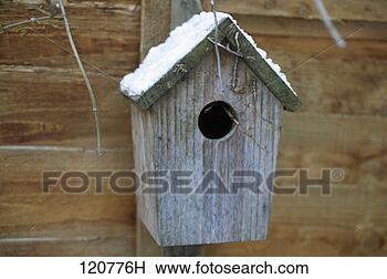 Stock Photo - a birdhouse with 
snow on its roof. 
fotosearch - search 
stock photos, 
pictures, images, 
and photo clipart