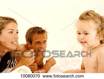Stock Photography - home, relaxing, 
woman, twenties, 
toddler, three. 
fotosearch - search 
stock photos, 
pictures, images, 
and photo clipart