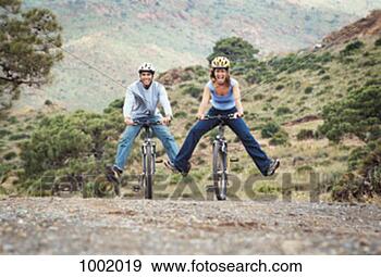 Stock Photograph - moutain, stretched, 
biking, downhill, 
legs, 0out. fotosearch 
- search stock 
photos, pictures, 
images, and photo 
clipart