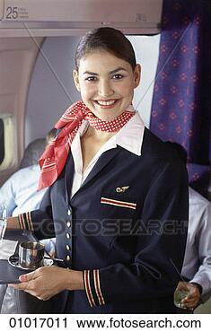 Stock Photography - a smiling airline 
stewardess holding 
a tray. fotosearch 
- search stock 
photos, pictures, 
images, and photo 
clipart
