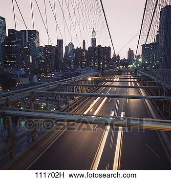 Stock Photo - high angle time 
lapse view of 
cars passing over 
the brooklyn bridge. 
fotosearch - search 
stock photos, 
pictures, images, 
and photo clipart