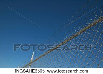 Stock Image - fence topped with 
barbed wire. fotosearch 
- search stock 
photos, pictures, 
images, and photo 
clipart