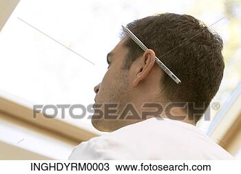 Stock Photo - close-up of a 
young man with 
a pencil behind 
his ear. fotosearch 
- search stock 
photos, pictures, 
images, and photo 
clipart