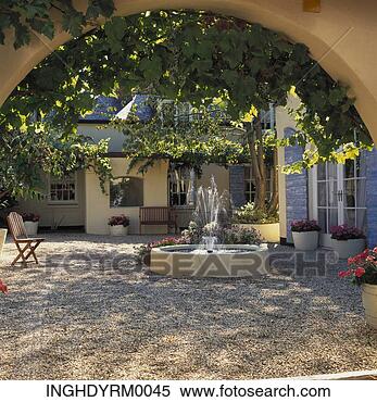 Stock Image - view of a stone 
garden with a 
fountain. fotosearch 
- search stock 
photos, pictures, 
images, and photo 
clipart