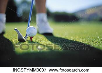 Picture - close-up of a 
golf club near 
a golf ball on 
a tee. fotosearch 
- search stock 
photos, pictures, 
images, and photo 
clipart