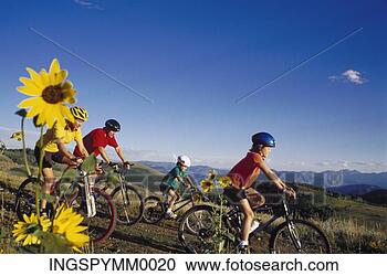 Stock Photography - family cycling 
on a hilly trail. 
fotosearch - search 
stock photos, 
pictures, images, 
and photo clipart