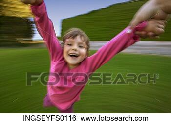 Stock Photo - girl flying around 
the merry-go-round. 
fotosearch - search 
stock photos, 
pictures, images, 
and photo clipart