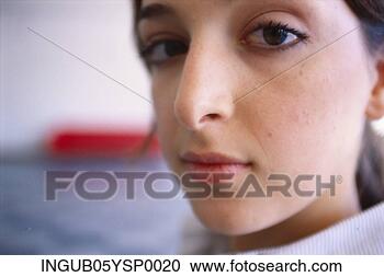 Stock Photography - close-up of a 
young woman looking 
at the camera. 
fotosearch - search 
stock photos, 
pictures, images, 
and photo clipart