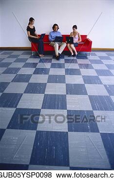 Stock Photo - young man and 
two young women 
sitting on a couch 
and working on. 
fotosearch - search 
stock photos, 
pictures, images, 
and photo clipart
