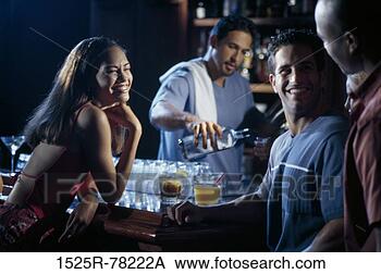 Stock Photo - multiethnic, pouring, 
drinking, flirting, 
bar, alcoholic. 
fotosearch - search 
stock photos, 
pictures, images, 
and photo clipart