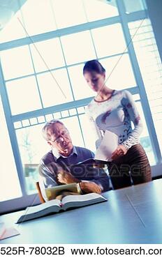 Stock Photo - teacher checking 
a student's notebook. 
fotosearch - search 
stock photos, 
pictures, images, 
and photo clipart