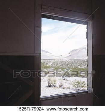 Stock Photo - shrubs and mountains 
seen through an 
window. fotosearch 
- search stock 
photos, pictures, 
images, and photo 
clipart