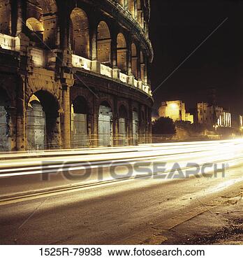 Stock Photo - traffic in front 
of a coliseum, 
colosseum, rome, 
italy. fotosearch 
- search stock 
photos, pictures, 
images, and photo 
clipart