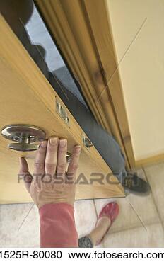 Stock Photography - woman pushing 
the door trying 
to stop a man 
from breaking 
in. fotosearch 
- search stock 
photos, pictures, 
images, and photo 
clipart