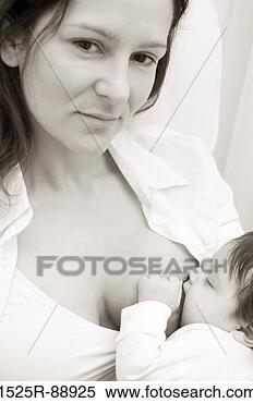 Stock Image - portrait of a 
mid adult woman 
breastfeeding 
her baby. fotosearch 
- search stock 
photos, pictures, 
images, and photo 
clipart