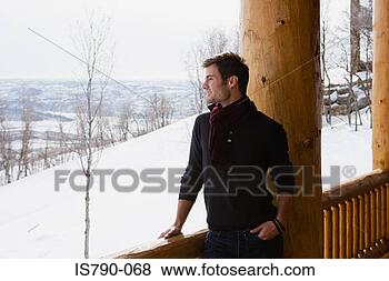 Stock Photo - young man looking 
at winter scene. 
fotosearch - search 
stock photos, 
pictures, images, 
and photo clipart