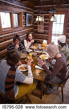 Stock Photo - friends having 
breakfast in chalet. 
fotosearch - search 
stock photos, 
pictures, images, 
and photo clipart