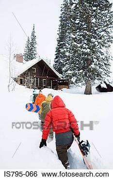 Stock Photo - snowboarders returning 
to chalet. fotosearch 
- search stock 
photos, pictures, 
images, and photo 
clipart
