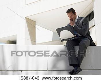 Stock Photo - businessman working 
on laptop. fotosearch 
- search stock 
photos, pictures, 
images, and photo 
clipart