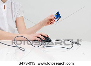 Stock Photo - woman holding 
credit card. fotosearch 
- search stock 
photos, pictures, 
images, and photo 
clipart
