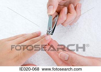 Stock Photo - woman having a 
manicure. fotosearch 
- search stock 
photos, pictures, 
images, and photo 
clipart