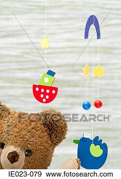 Stock Photograph - teddy bear and 
mobile. fotosearch 
- search stock 
photos, pictures, 
images, and photo 
clipart