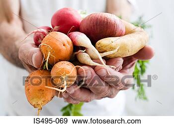 Stock Photograph - man holding vegetables. 
fotosearch - search 
stock photos, 
pictures, images, 
and photo clipart