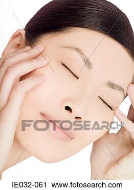 Stock Photography - serene looking 
chinese woman. 
fotosearch - search 
stock photos, 
pictures, images, 
and photo clipart