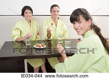 Stock Photo - women eating fruit. 
fotosearch - search 
stock photos, 
pictures, images, 
and photo clipart