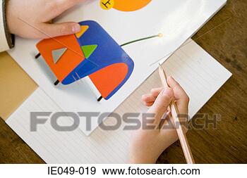 Stock Photograph - child holding 
a pencil. fotosearch 
- search stock 
photos, pictures, 
images, and photo 
clipart