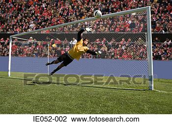 Stock Photo - goalkeeper making 
a save. fotosearch 
- search stock 
photos, pictures, 
images, and photo 
clipart