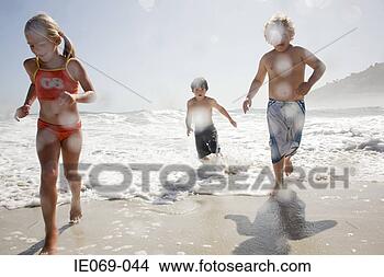 Stock Photo - kids running from 
waves. fotosearch 
- search stock 
photos, pictures, 
images, and photo 
clipart