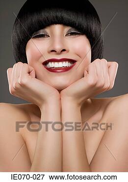 Picture - smiling woman 
leaning on hands. 
fotosearch - search 
stock photos, 
pictures, images, 
and photo clipart
