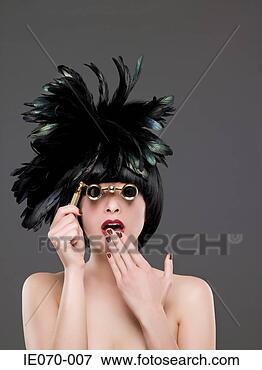Picture - woman looking 
through vintage 
binoculars. fotosearch 
- search stock 
photos, pictures, 
images, and photo 
clipart