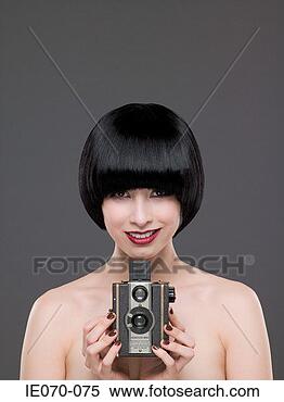 Stock Image - woman using a 
vintage camera. 
fotosearch - search 
stock photos, 
pictures, images, 
and photo clipart