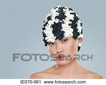 Stock Photography - woman wearing 
a floral hat. 
fotosearch - search 
stock photos, 
pictures, images, 
and photo clipart