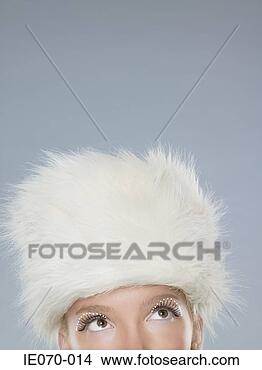 Stock Photo - woman wearing 
a white fur hat. 
fotosearch - search 
stock photos, 
pictures, images, 
and photo clipart