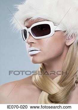 Stock Photography - woman wearing 
white sunglasses. 
fotosearch - search 
stock photos, 
pictures, images, 
and photo clipart