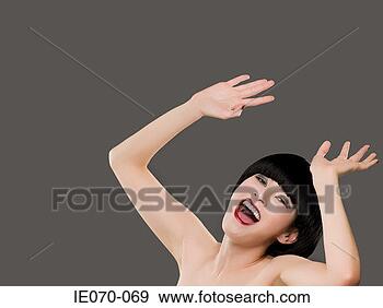 Stock Photograph - young woman with 
her hands raised. 
fotosearch - search 
stock photos, 
pictures, images, 
and photo clipart