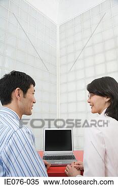 Stock Image - colleagues with 
laptop. fotosearch 
- search stock 
photos, pictures, 
images, and photo 
clipart