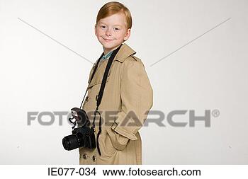 Stock Photo - a boy with a camera. 
fotosearch - search 
stock photos, 
pictures, images, 
and photo clipart