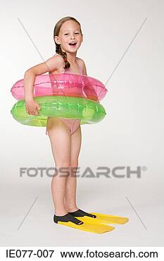 Picture - a girl wearing 
inflatable rings. 
fotosearch - search 
stock photos, 
pictures, images, 
and photo clipart