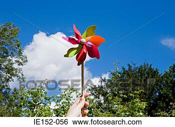 Stock Photo - a person holding 
a pinwheel. fotosearch 
- search stock 
photos, pictures, 
images, and photo 
clipart
